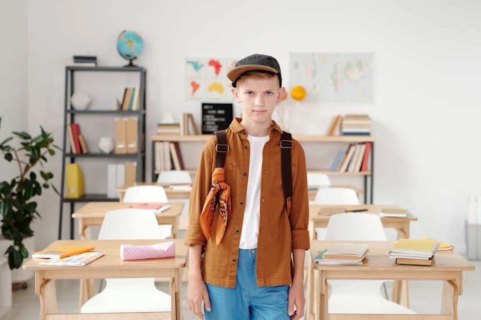 A collection of ancient manuscripts and linguistic maps spread across a scholar's desk